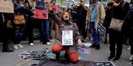 A,Woman,Cuts,Her,Hair,During,A,Demonstration,In,Front