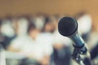 Microphone voice speaker with audiences or students in seminar classroom, lecture hall or conference meeting in educational business event for host, teacher, or coaching mentor