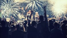 New Year concept – cheering crowd and fireworks