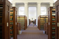 MASSACHUSETTS Boston Harvard Law School library interior with rows of books and aisle down center