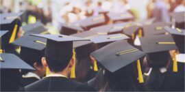 black and gold mortarboard hats_shutterstock_1358285150