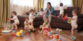 Tired,Woman,Sitting,On,A,Sofa,In,The,Room.,Child