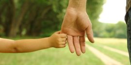 Child Holding Adult Hand