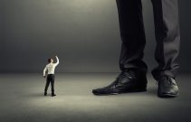 man showing fist to his big boss