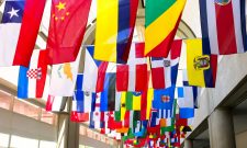 Flags of the world displayed at a convention center