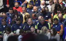 CHARLESTON, WV – MAY 5: Coal miners and their families pray bef