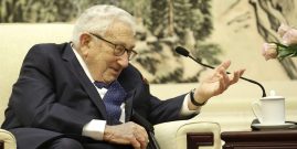 Former U.S. Secretary of State Henry Kissinger speaks during a meeting with Chinese Foreign Minister Wang Yi in Beijing