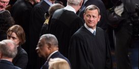 John Roberts, Chief Justice of the U.S. Supreme Court wait for the start of the State of the Union Address on Capitol Hill.