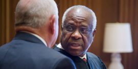 Former Georgia Gov. Sonny Perdue, left, chats with Supreme Court Clarence Thomas following his swearing in ceremony as the 31st U.S. Secretary of Agriculture at the Supreme Court April 25, 2017 in Washington, DC.