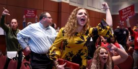 Angry parents and community members protest after a Loudoun County School Board meeting was halted by the school board because the crowd refused to quiet down, in Ashburn, Virginia, U.S.  June 22, 2021. REUTERS/Evelyn Hockstein