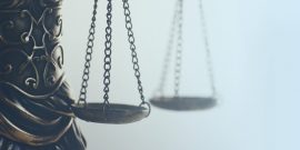 Scales of Justice Close